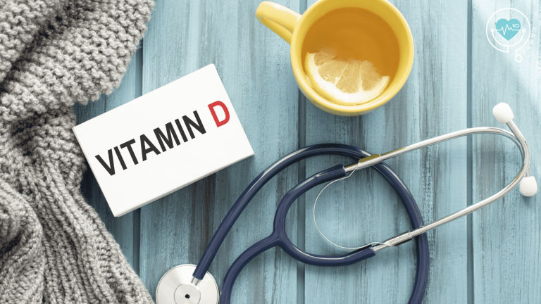 Vitamin D card with stethoscope and lemon drink on table