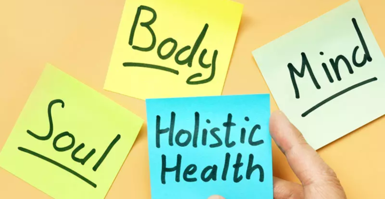 Sticky notes with words Body Mind Soul and Holistic Health