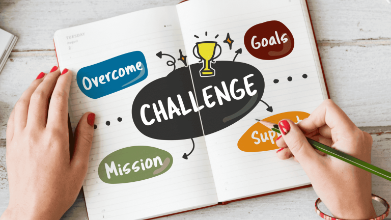 Notebook with challenge concept and goal planning notes