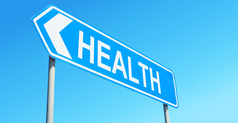 Road sign pointing to health