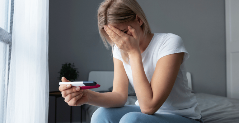 Woman experiencing abdominal bloating before menstruation
