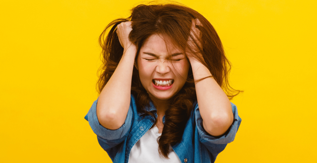 Young woman looking stressed and confused about unexplained weight gain