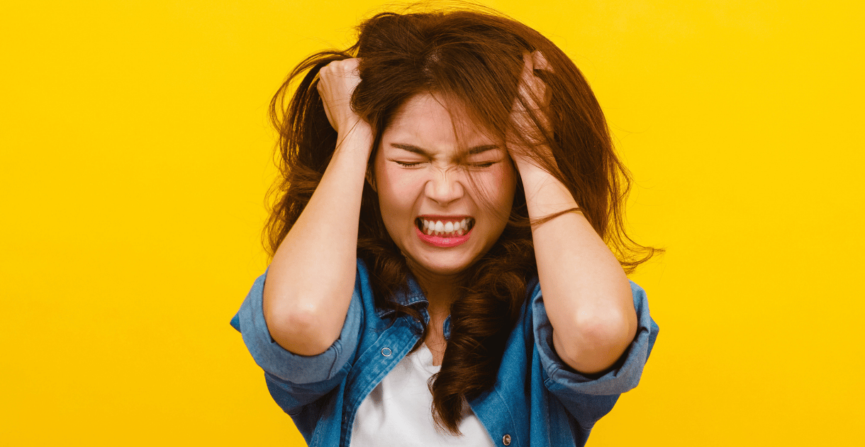 Young woman looking stressed and confused about unexplained weight gain