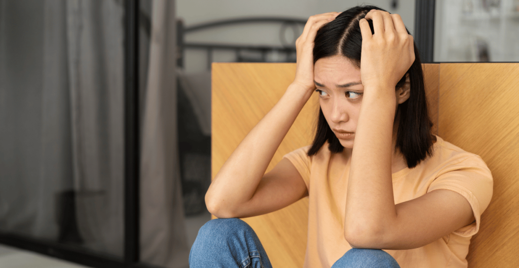Young woman looking stressed and confused about unexplained weight gain