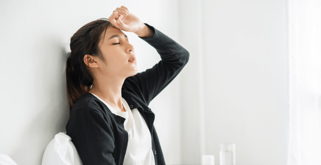 Young woman looking stressed and confused about unexplained weight gain